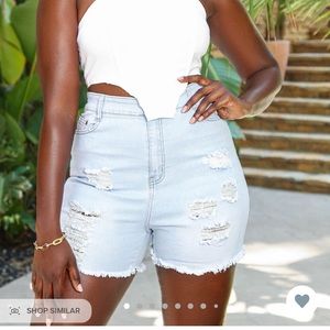 Distressed light blue shorts